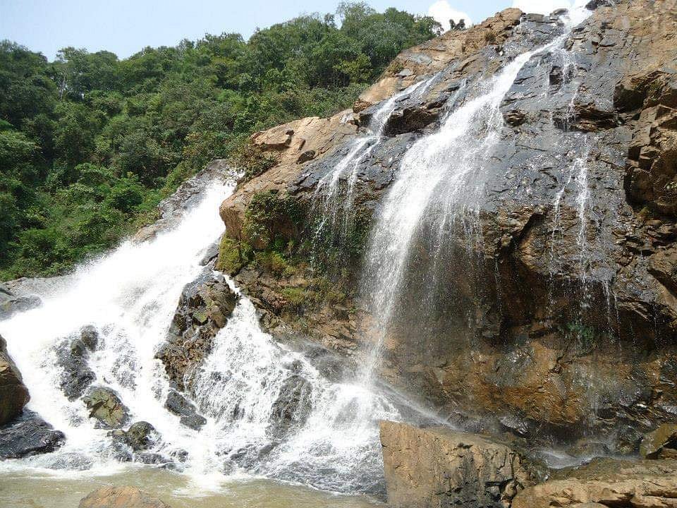View of Dudhani Waterfall in West Singhbhum surrounded by lush forests.